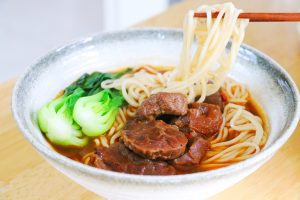 Bowl of Spicy Red Braised Beef Noodle Soup